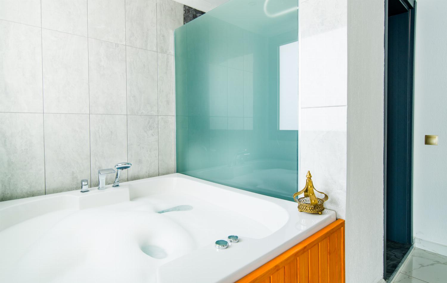 En suite bathroom with bath
