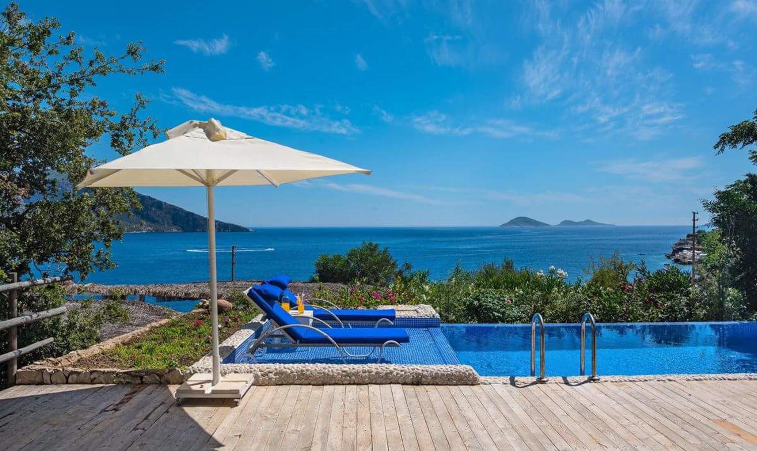 Open-plan living room with sofa,  WiFi internet, satellite TV, and sea views