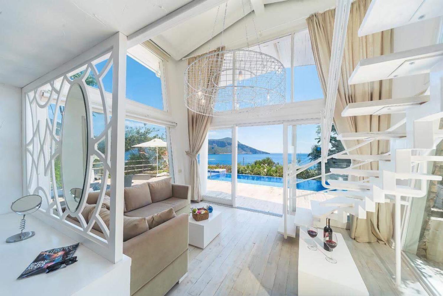 Open-plan living room with sofa,  WiFi internet, satellite TV, and sea views