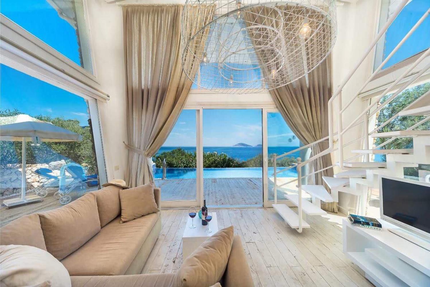 Open-plan living room with sofa,  WiFi internet, satellite TV, and sea views