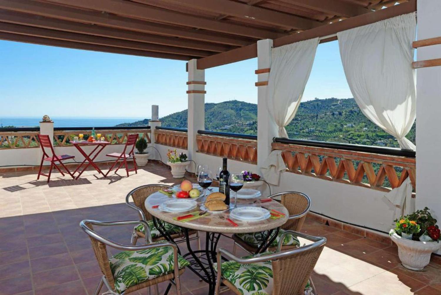 Outside area with garden sea view and BBQ