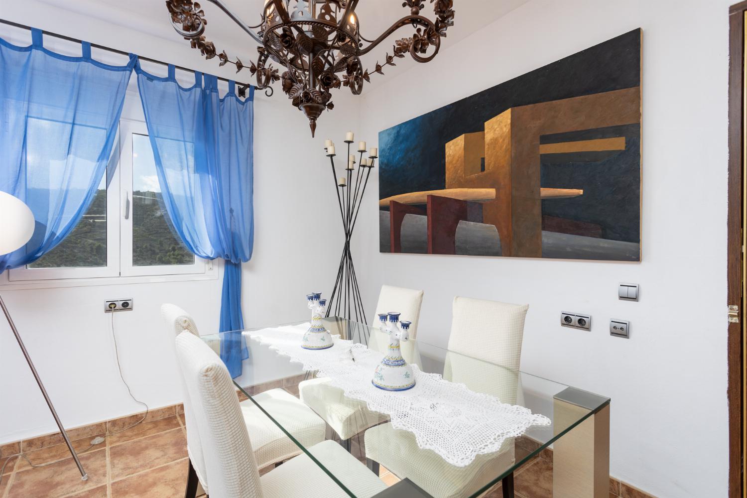 Living room with sofas, dining area, ornamental fireplace, WiFi internet, and satellite TV
