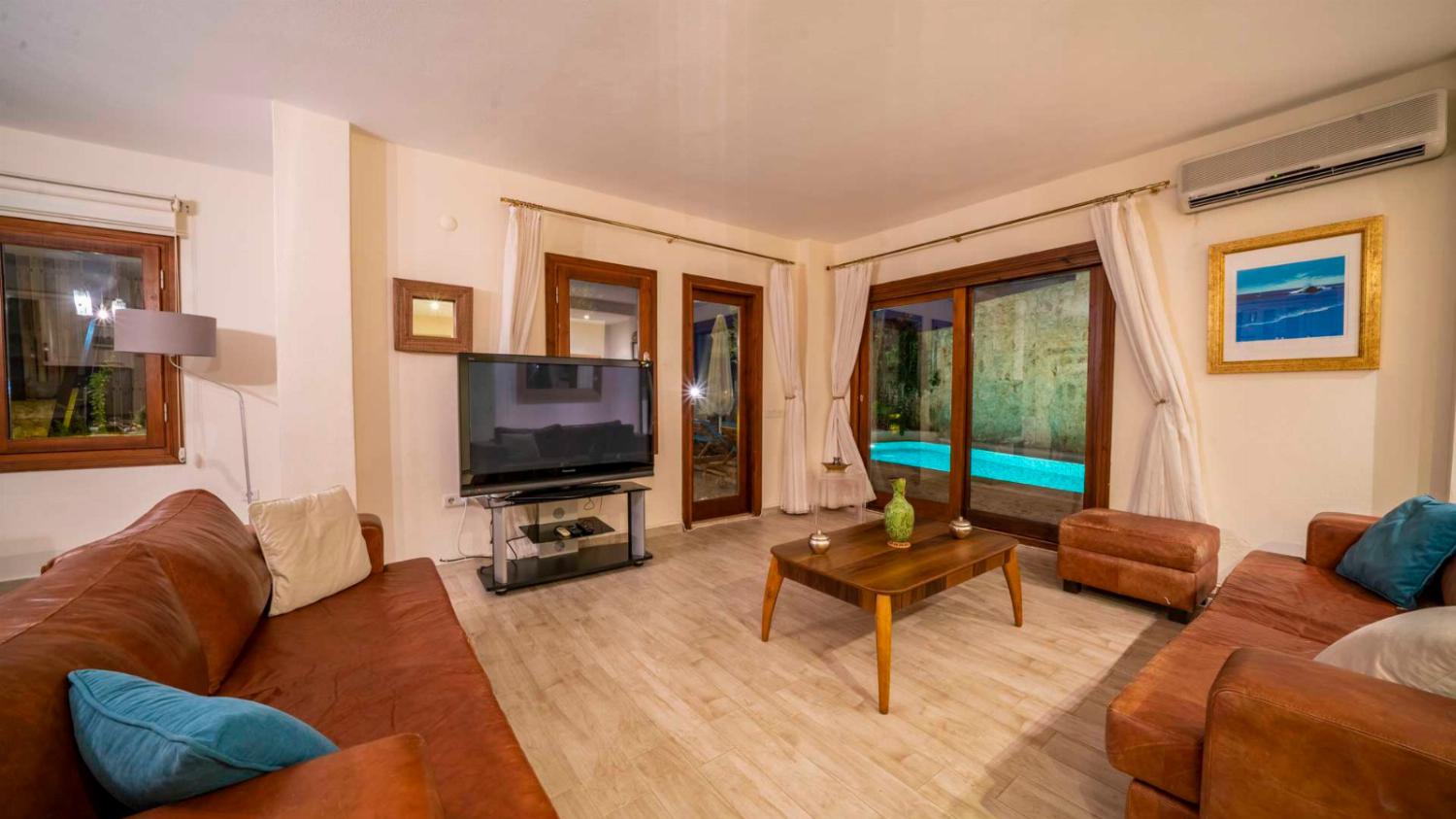 ,Open-plan living room with sofas, dining areas, kitchen