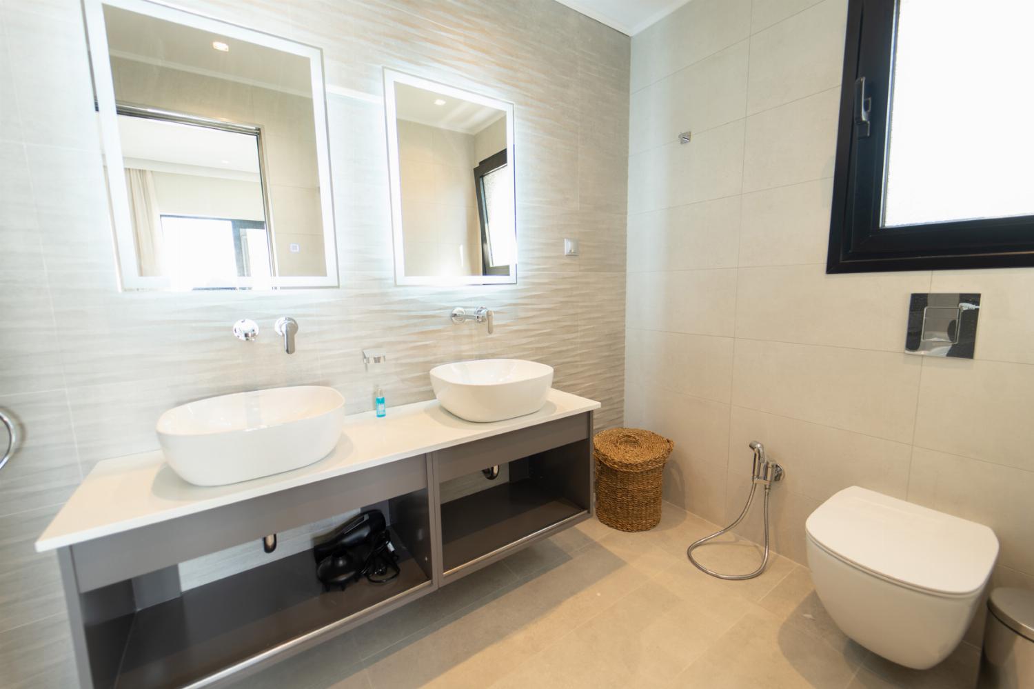 Ensuite bathroom with bath and shower and WC