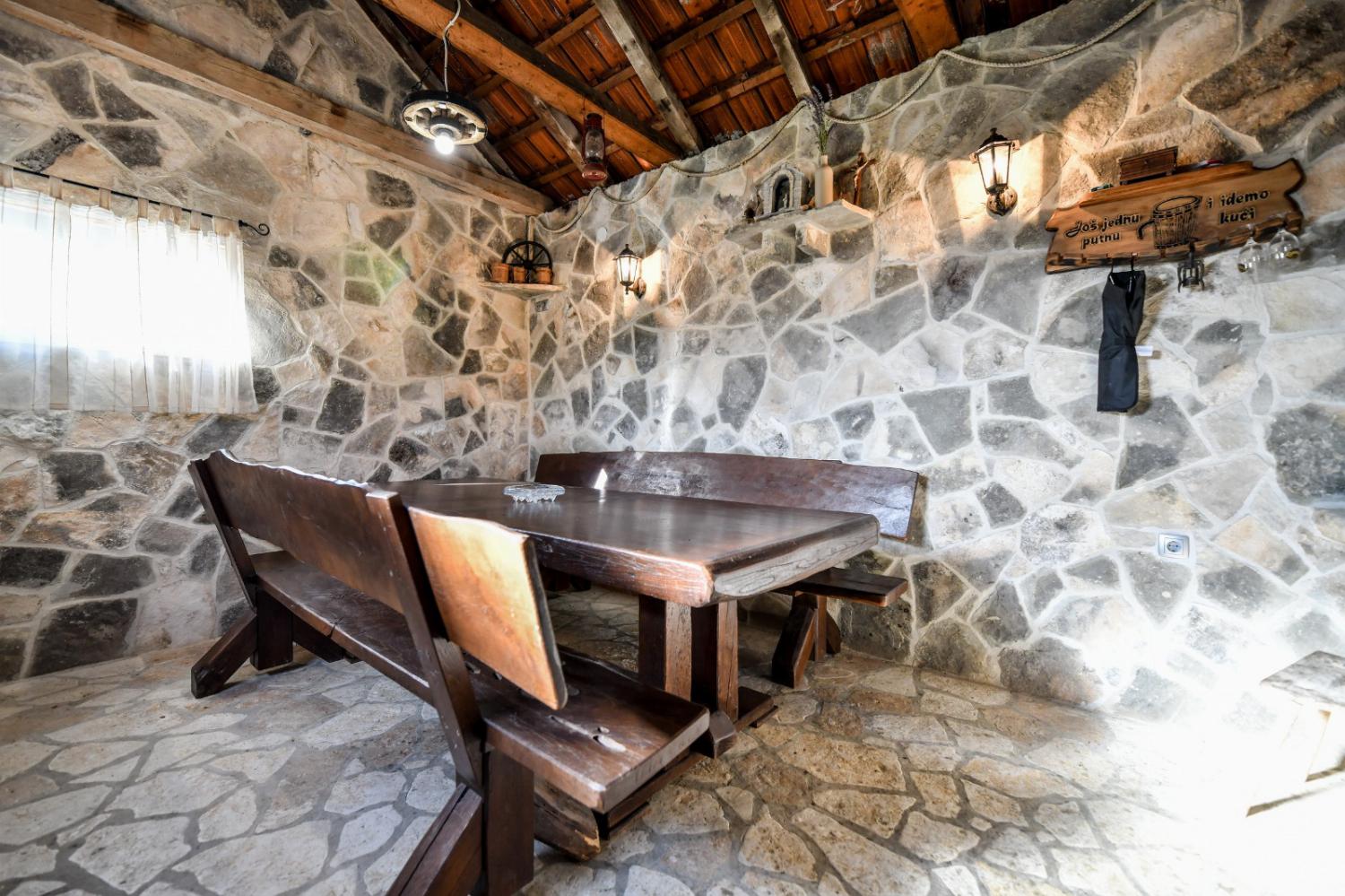 Sheltered dining area with wood fire oven/grill