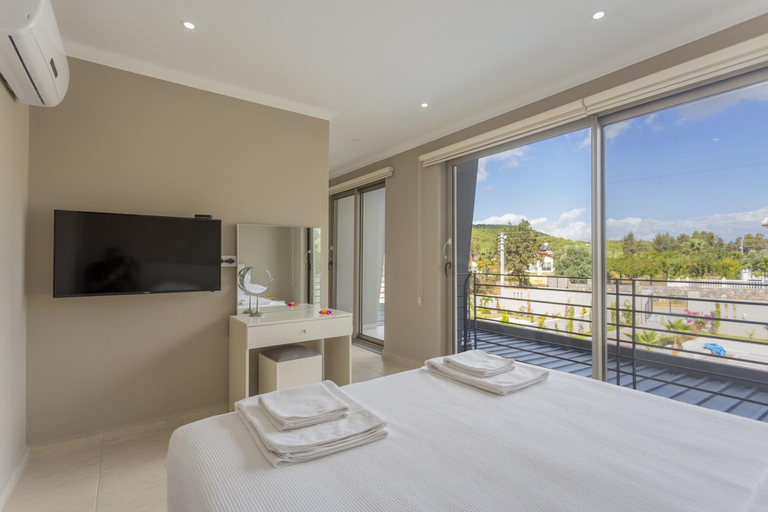 Double bedroom with en suite bathroom  tv and upper terrace access