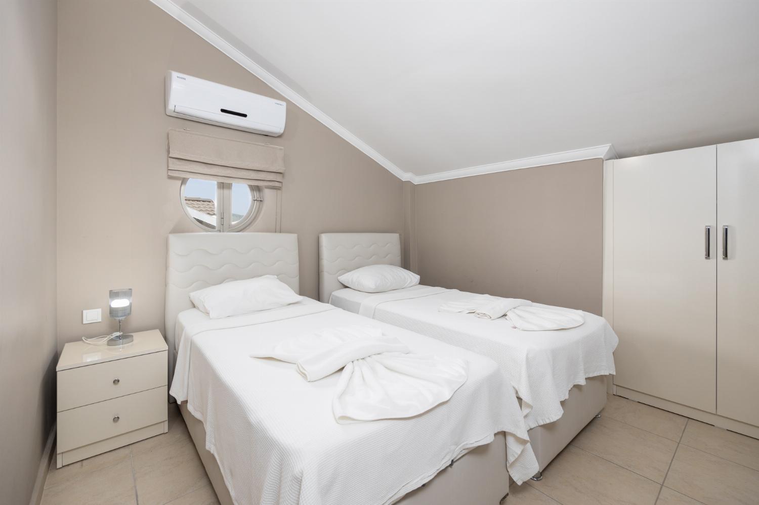 Twin bedroom with A/C and TV