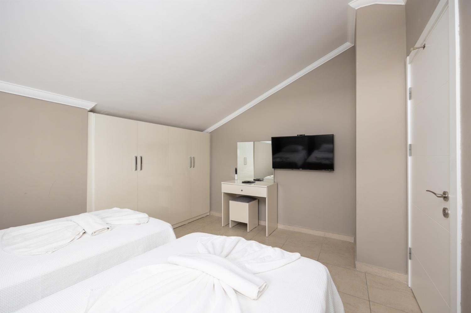 Twin bedroom with A/C and TV