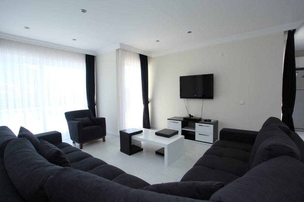 Open-plan living room with comfortable sitting, WiFi, TV, dining area