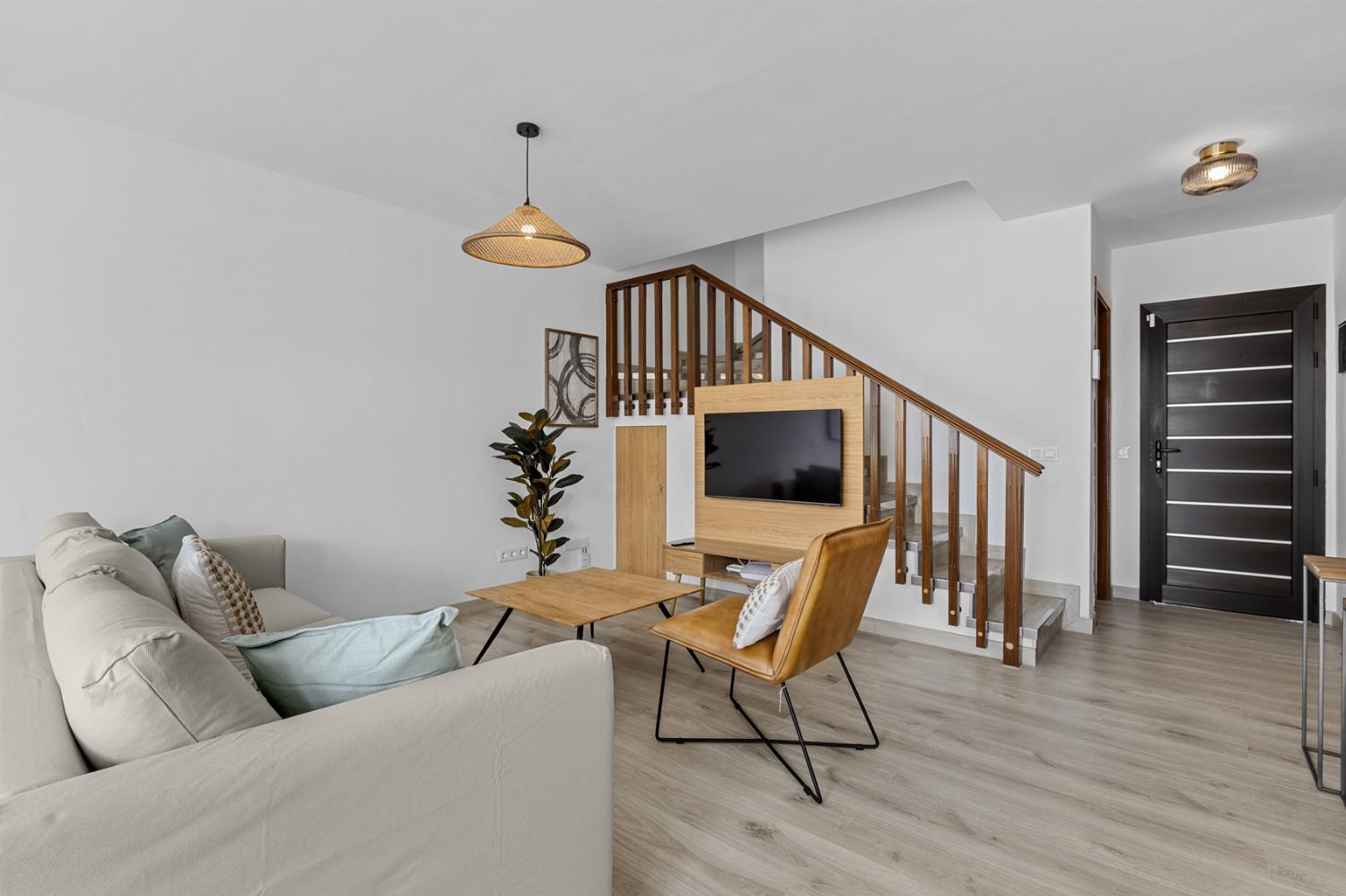 ,Open-plan living room with sofas, dining area, kitchen, WiFi internet, satellite TV