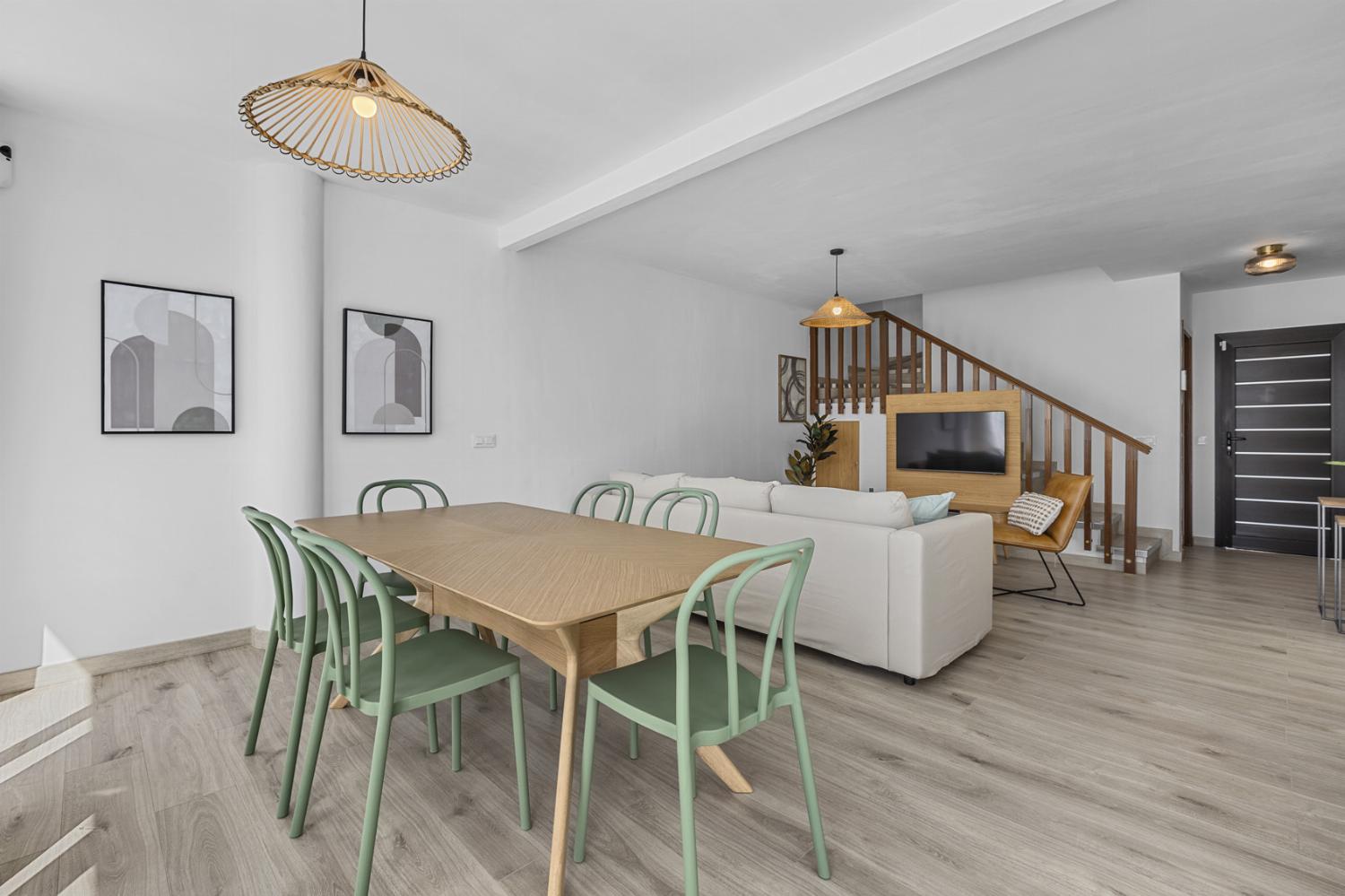 Open-plan living room with sofa, dining area, kitchen, WiFi internet, satellite TV, and sea views