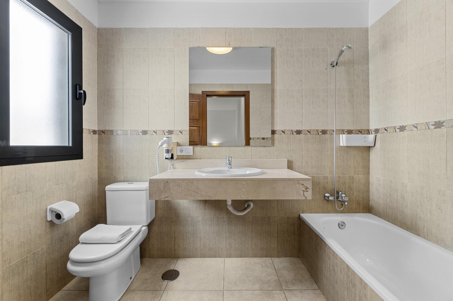 Family bathroom with bath