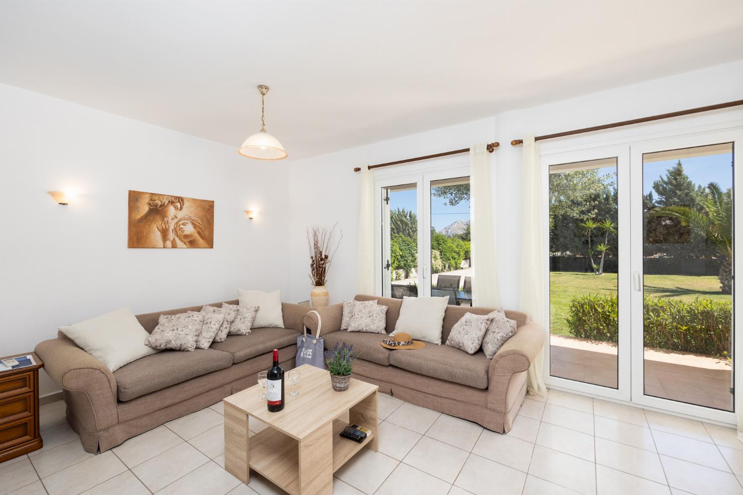 Living room with sofas, A/C, WiFi internet, and satellite TV