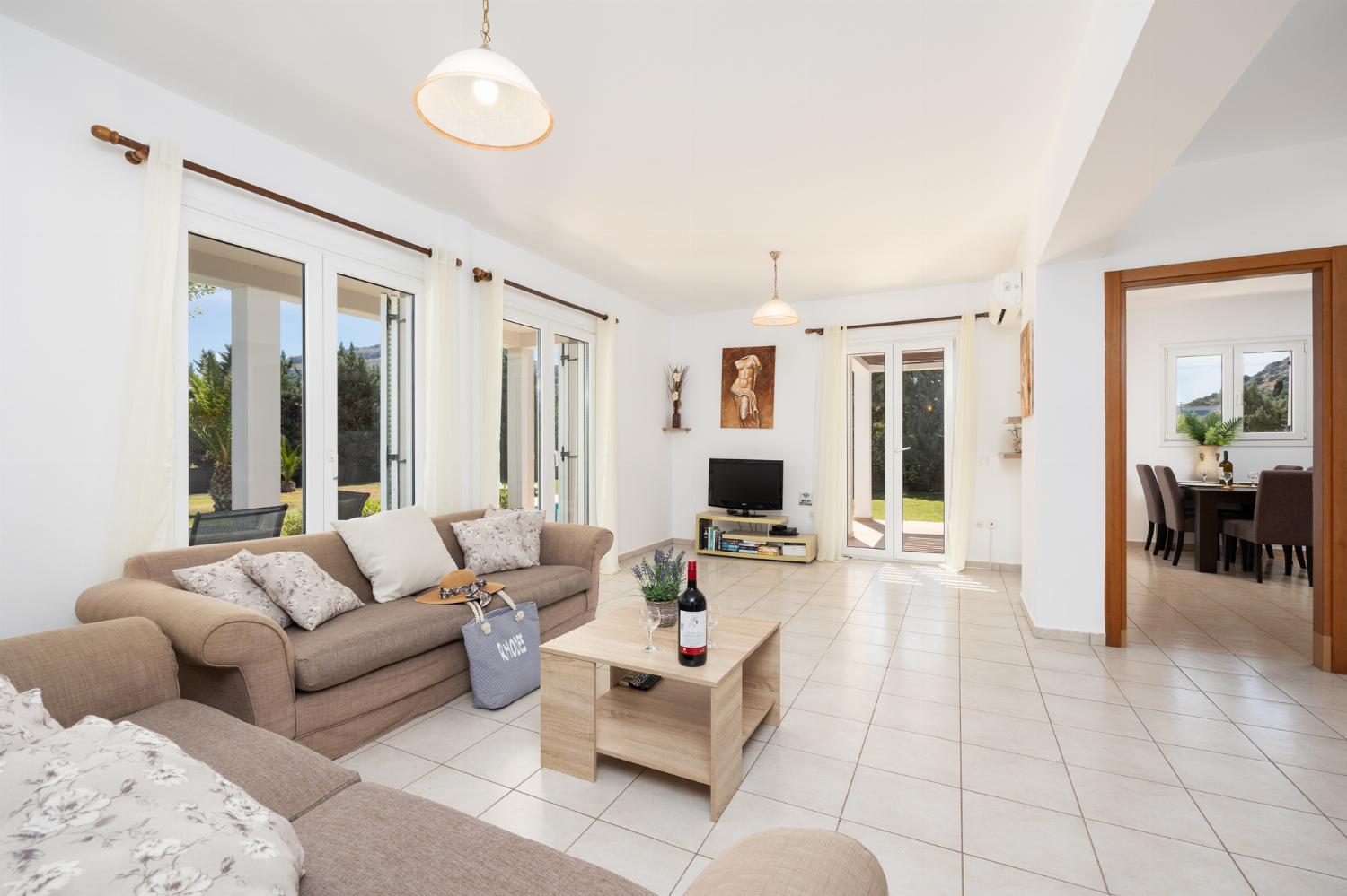 Living room with sofas, A/C, WiFi internet, and satellite TV