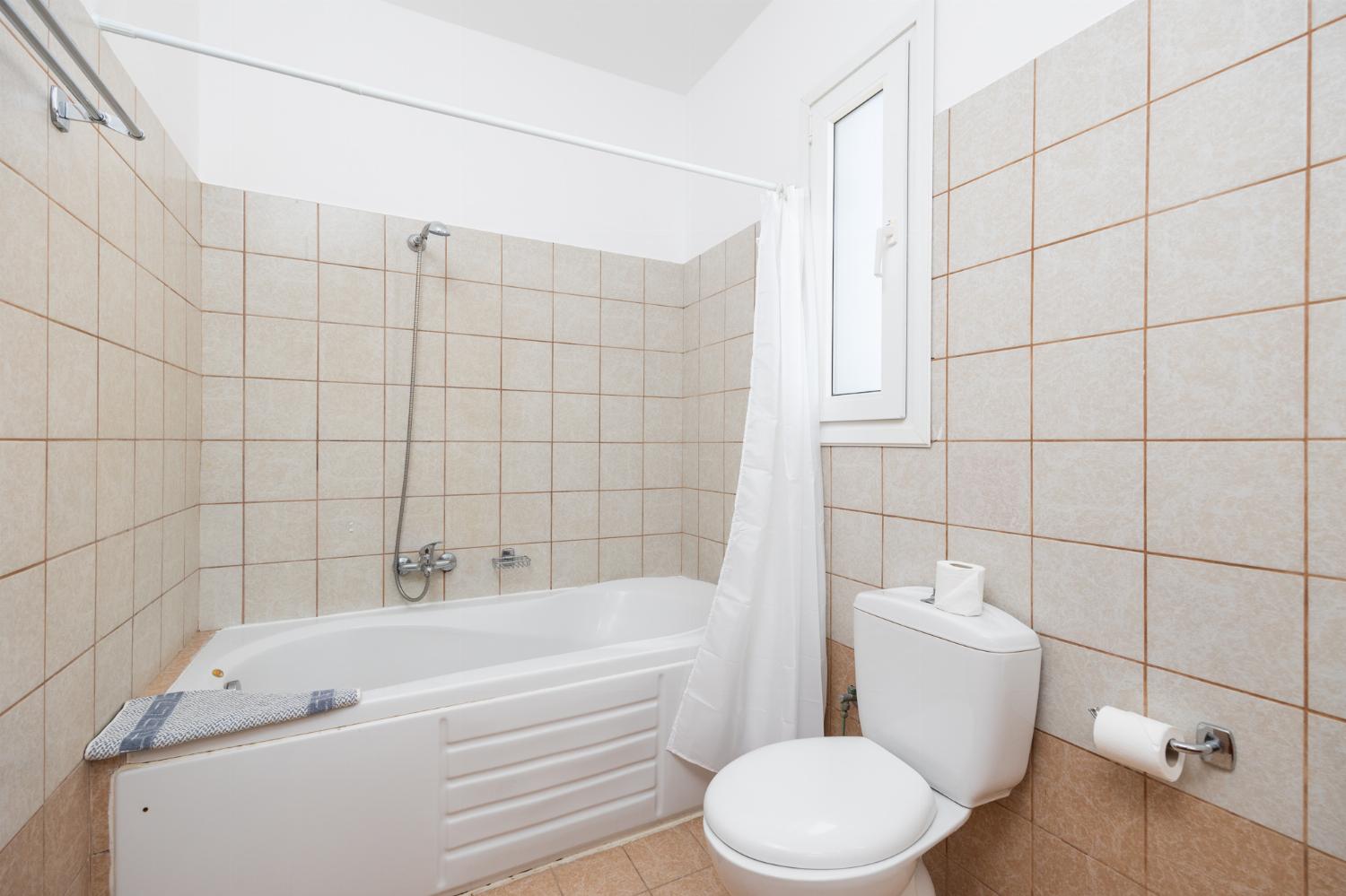 Family bathroom with bath and shower