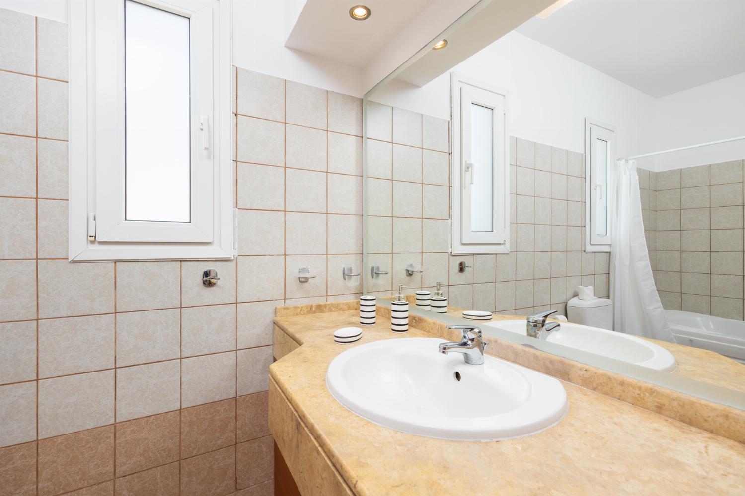 Family bathroom with bath and shower