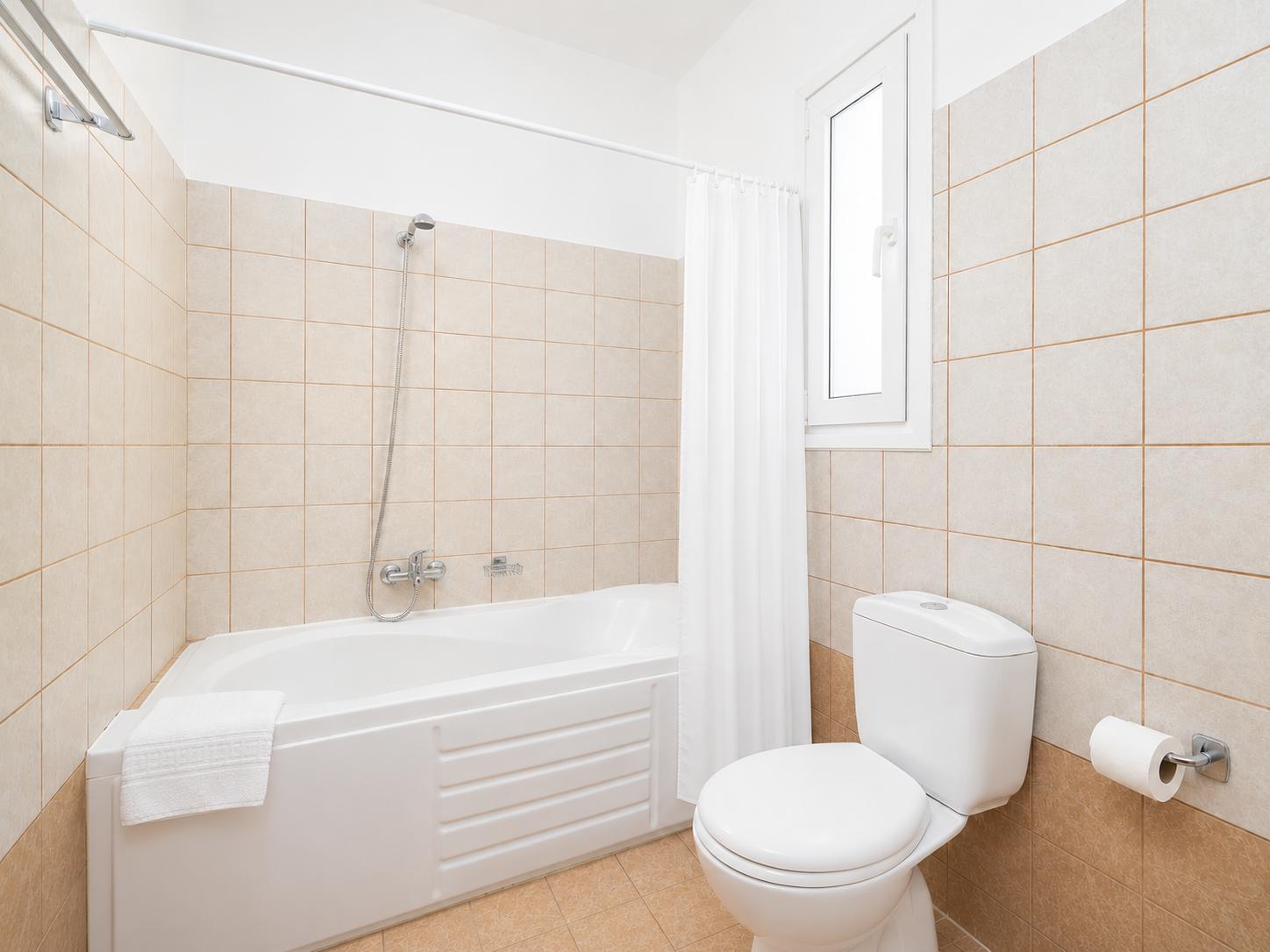 Family bathroom with bath and shower