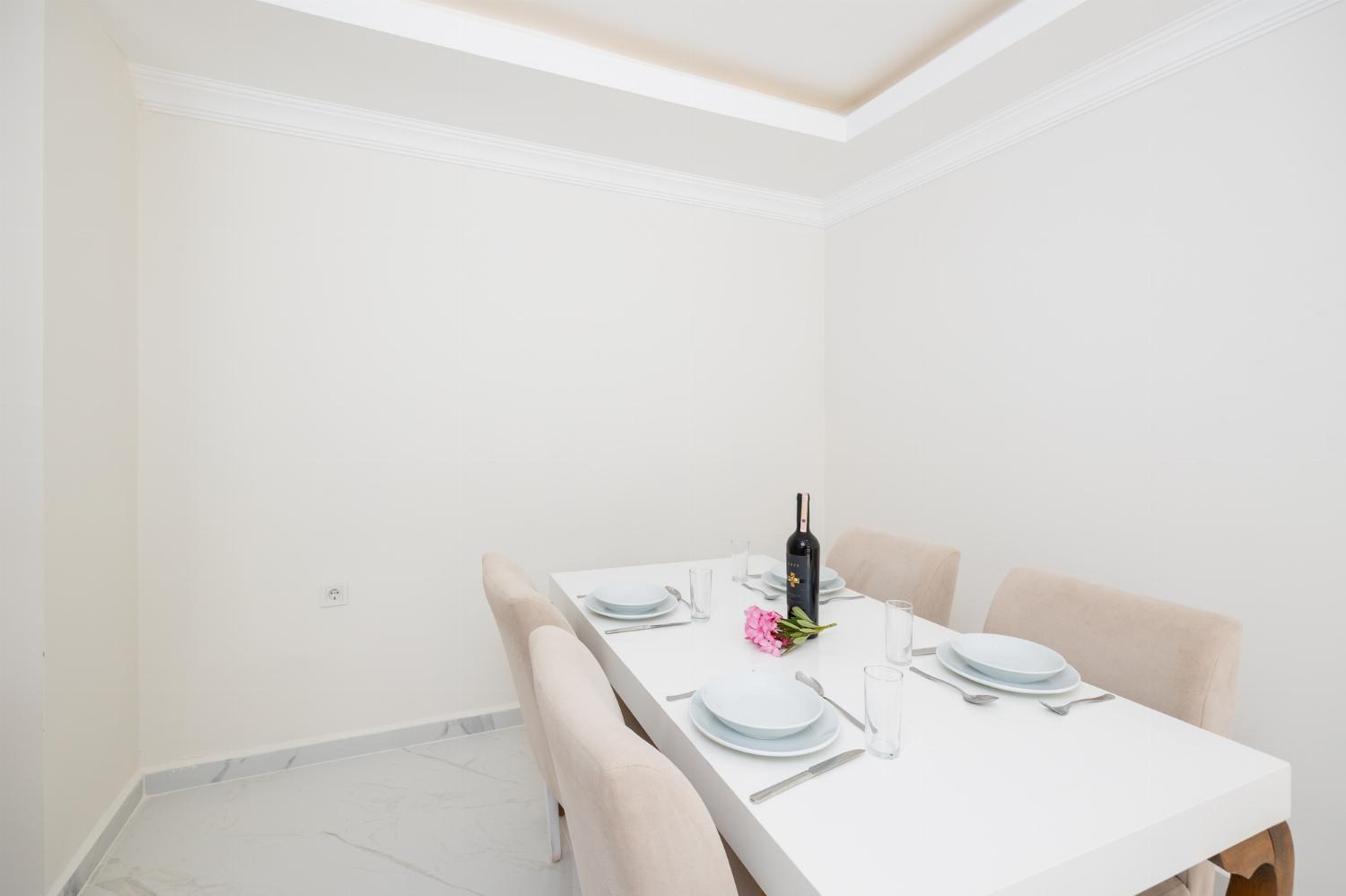 Living room with sofas, dining area, A/C, WiFi internet, and satellite TV