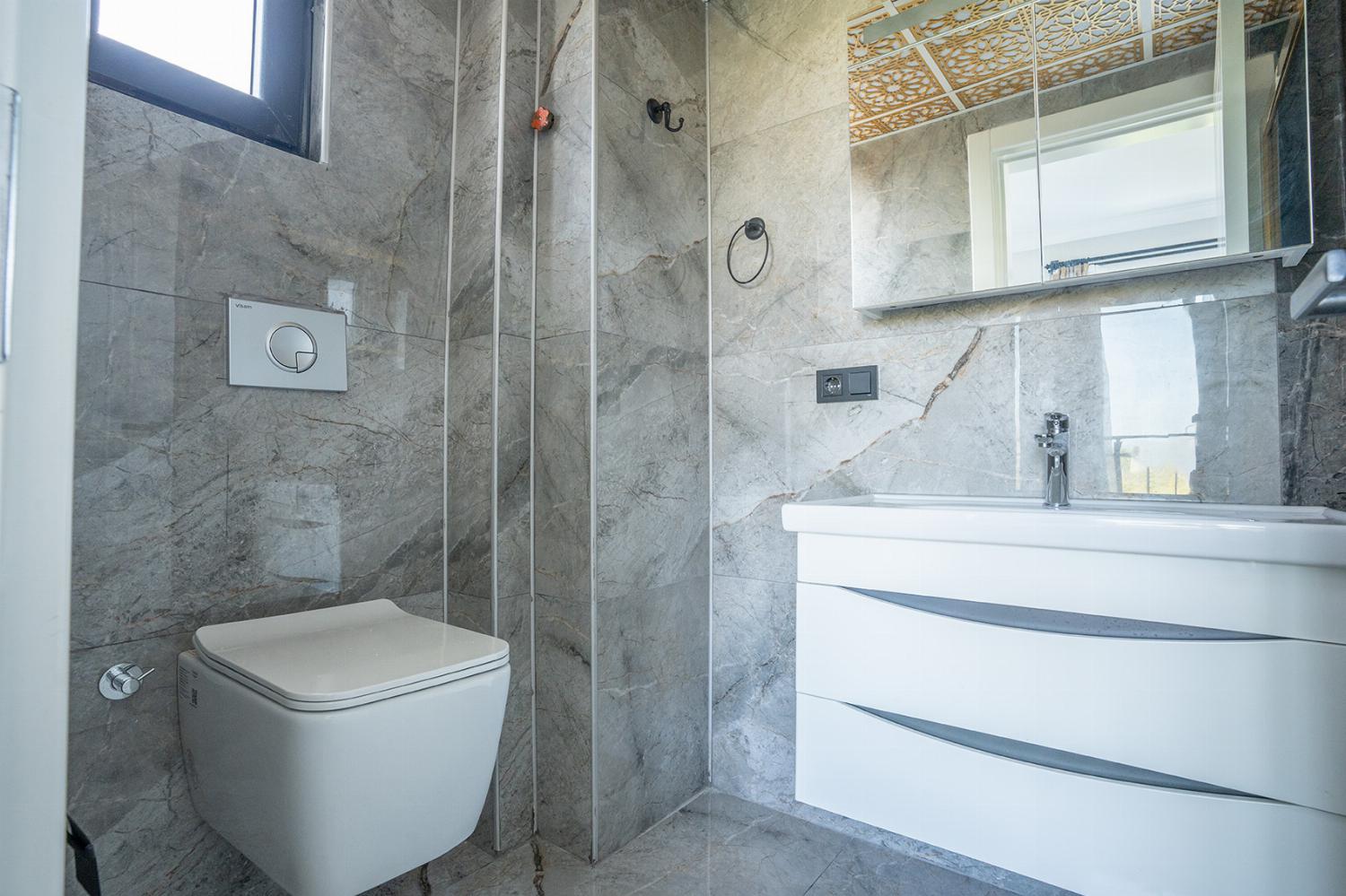 En suite bathroom with shower and WC