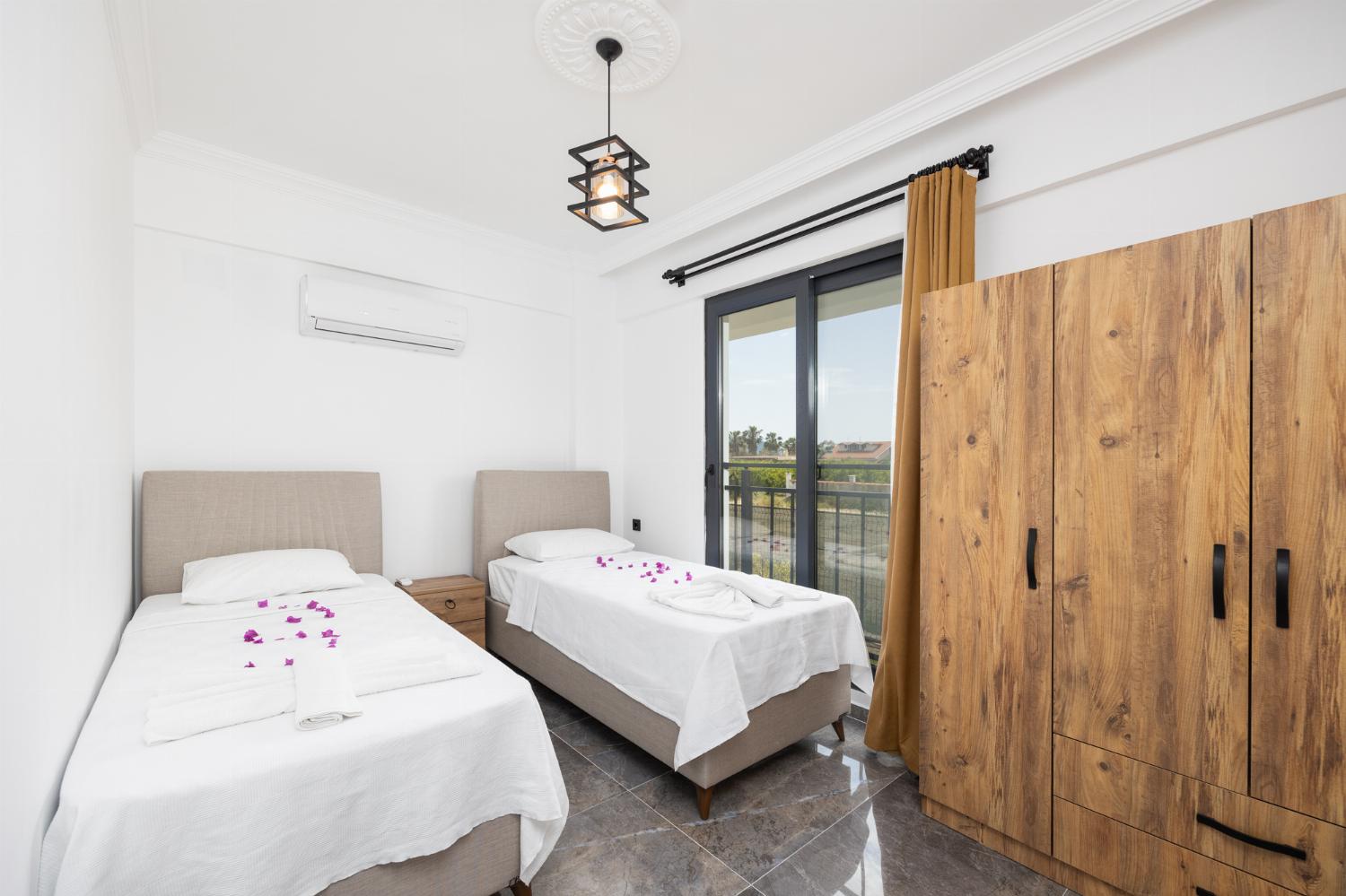 Twin bedroom with en suite bathroom and A/C