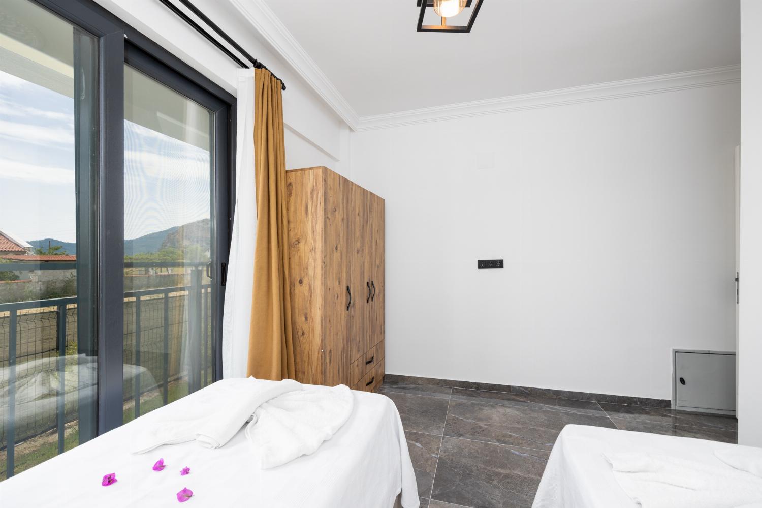 Twin bedroom with en suite bathroom and A/C