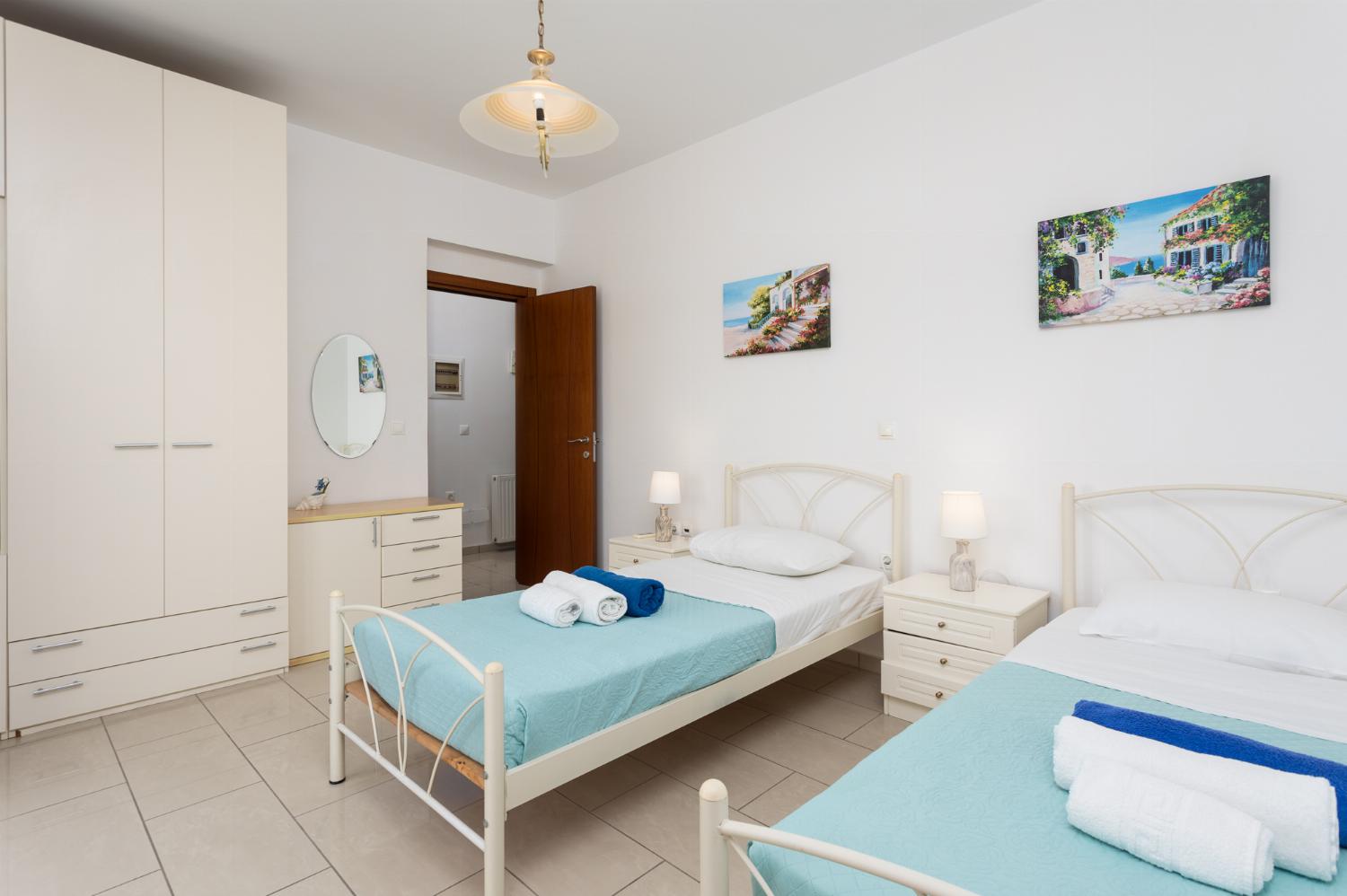 Twin bedroom with A/C and balcony access