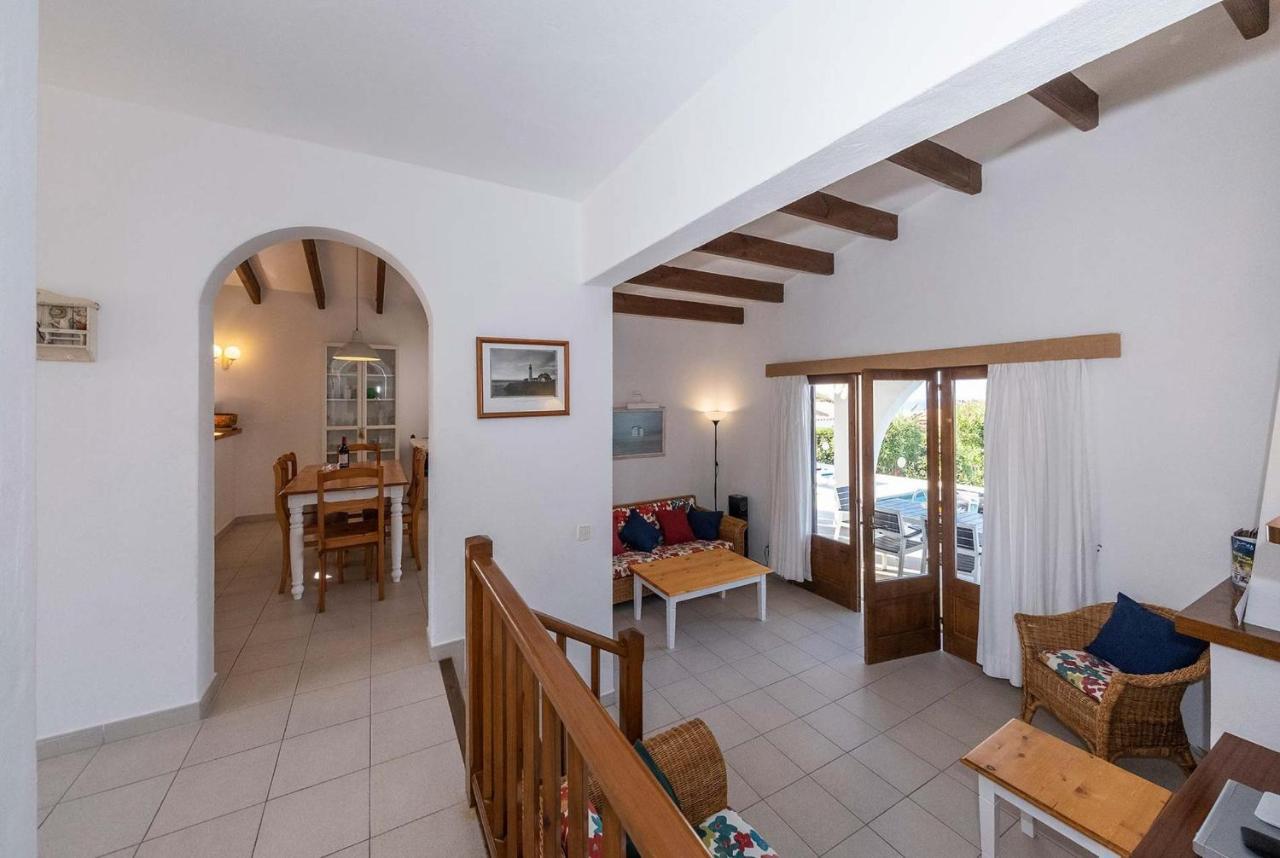 Open-plan living room with, dining area, kitchen, A/C, WiFi internet, satellite TV, DVD player, and pool terrace access