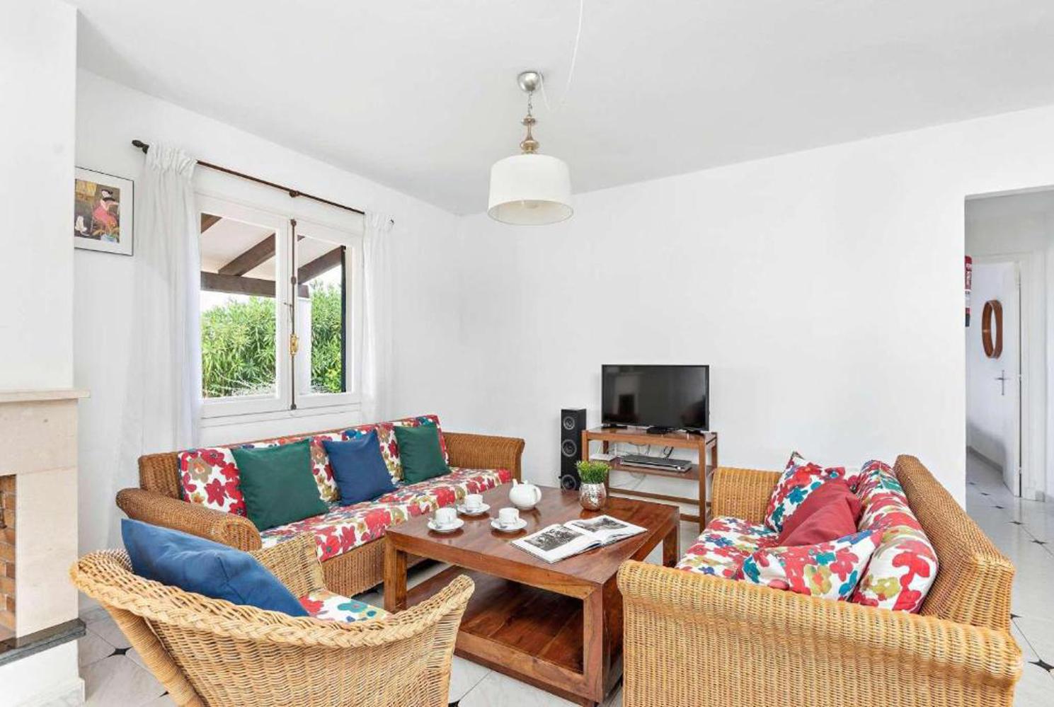 Open plan living room with A/C patio doors comfortable sofas, WiFi, TV dining area