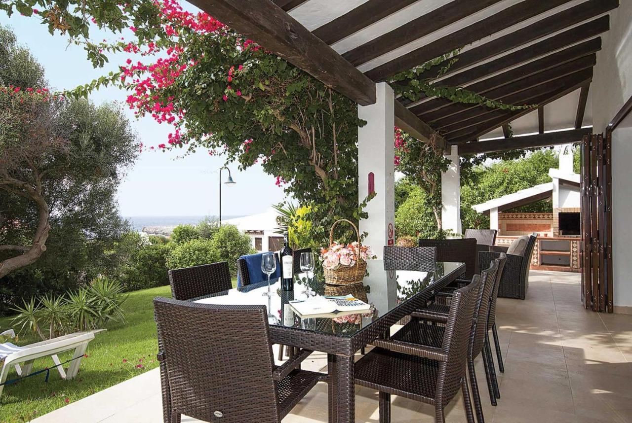 Sheltered terrace with dinning area and lawn