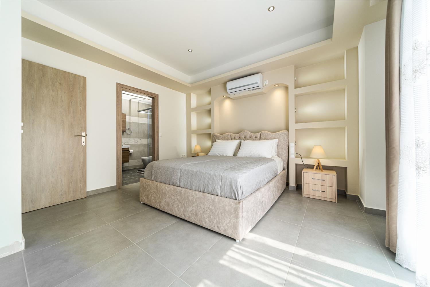 Double bedroom with A/C, en suite bathroom and  terrace access with panoramic views