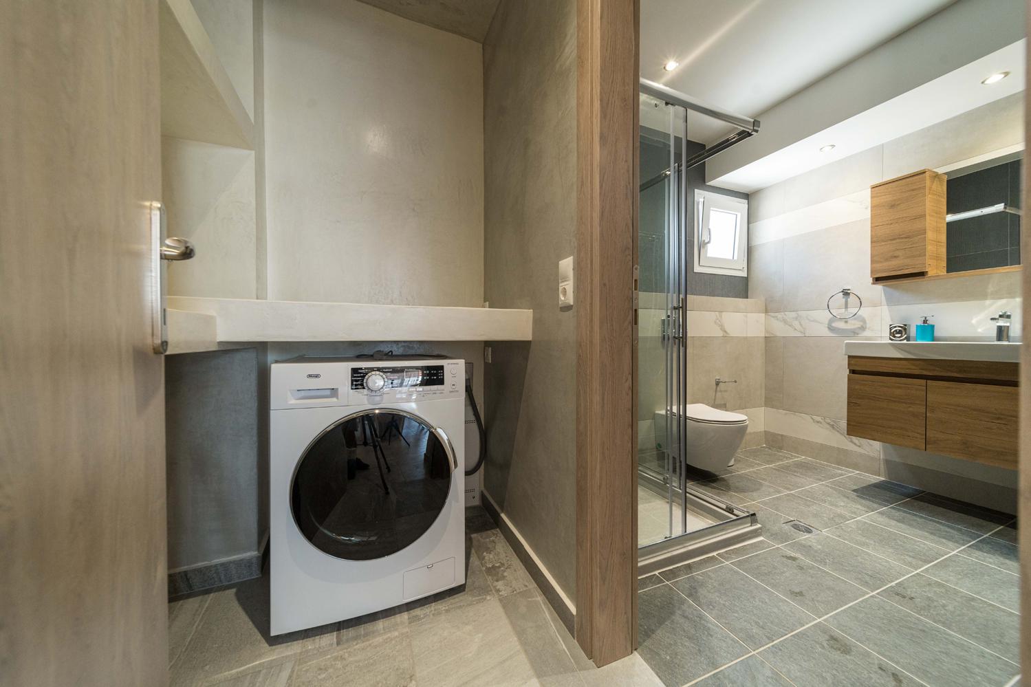 Family bathroom with shower and washing machine