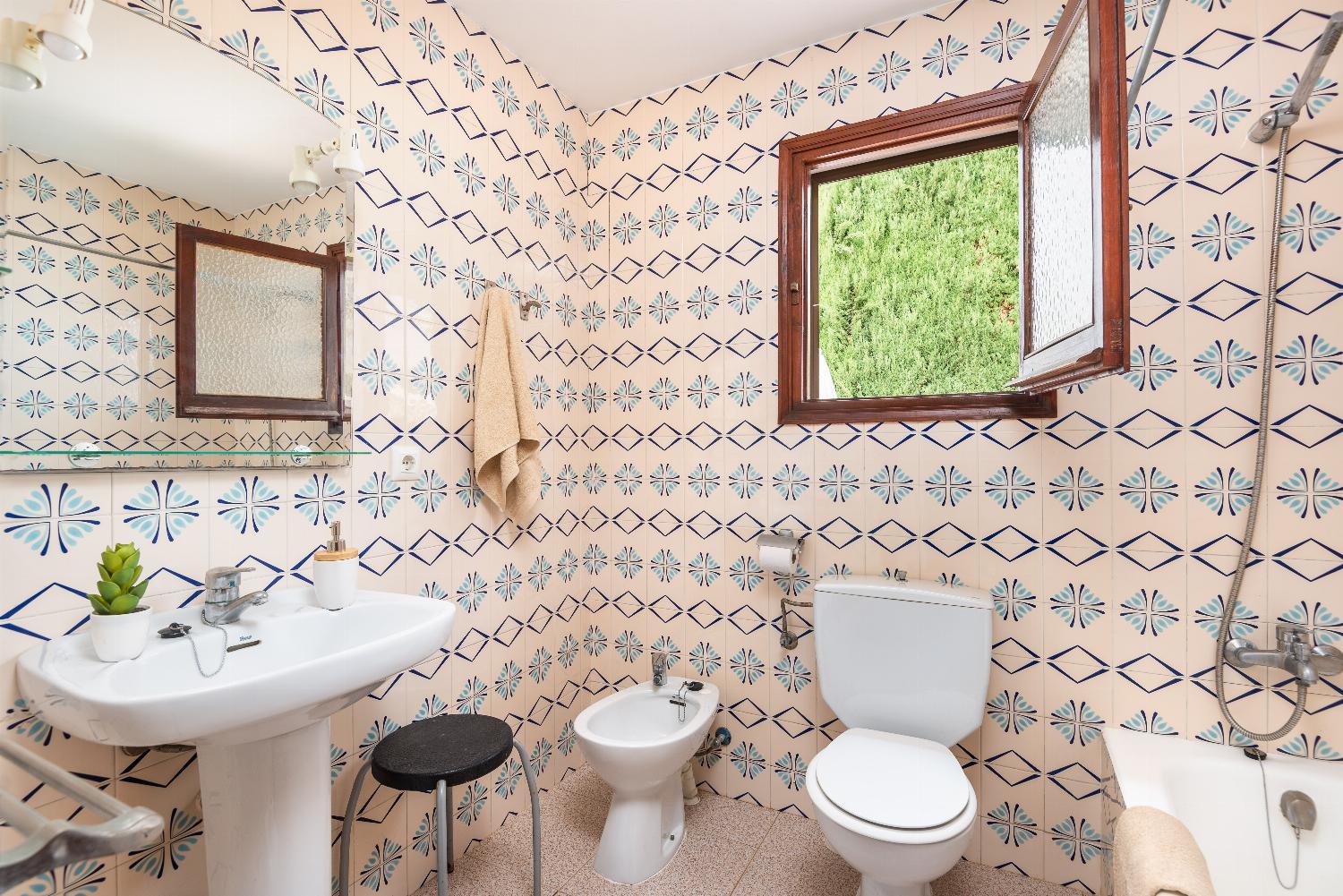 En suite bathroom with bath