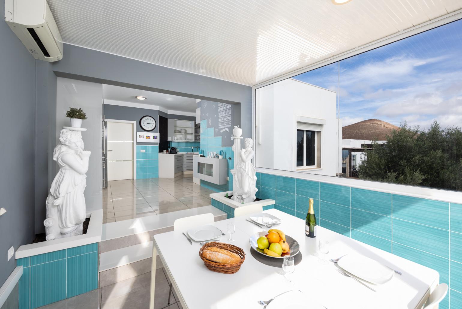 Dining area with A/C, TV, and sea views
