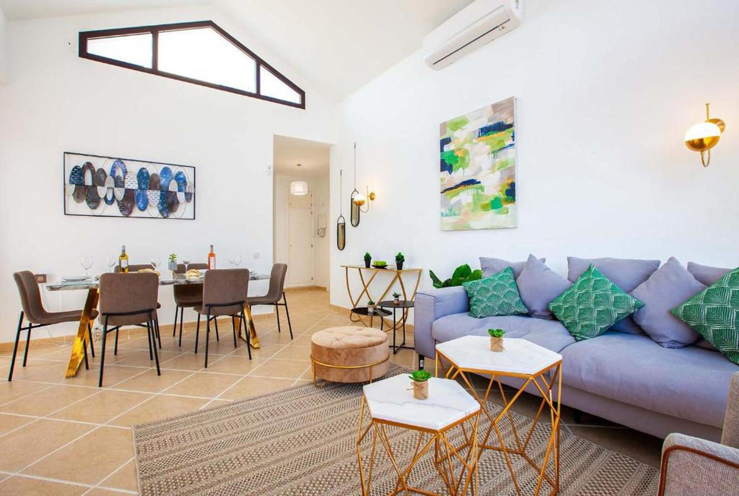 Open-plan living room with WiFi, A/C, comfortable sofas, TV, DVD, patio doorsOpen-plan living room with WiFi, A/C, comfortable sofas, TV, DVD, patio doors