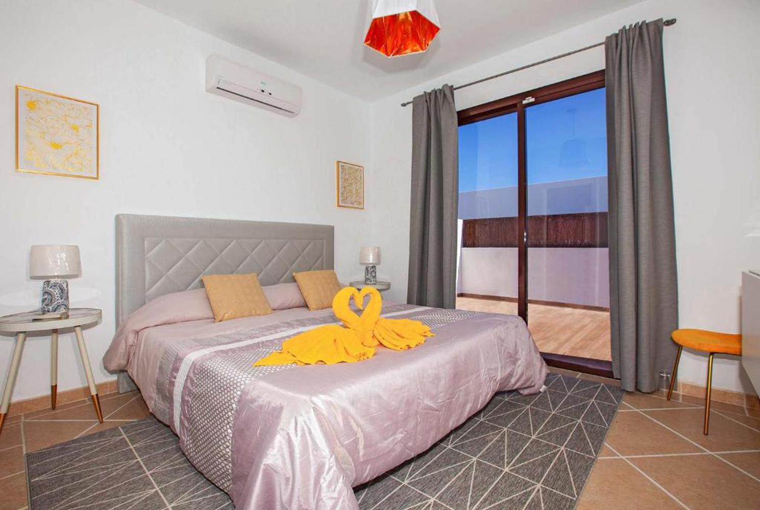 Double bed bedroom with A/C  en suite bathroom and terrace access