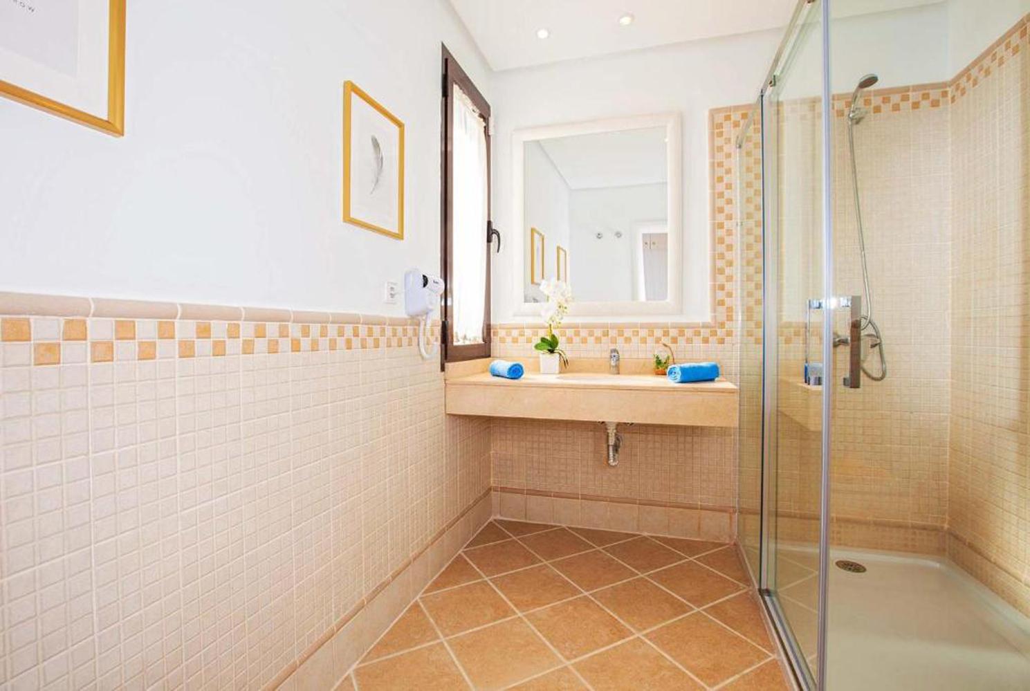 En suite bathroom with shower and WC