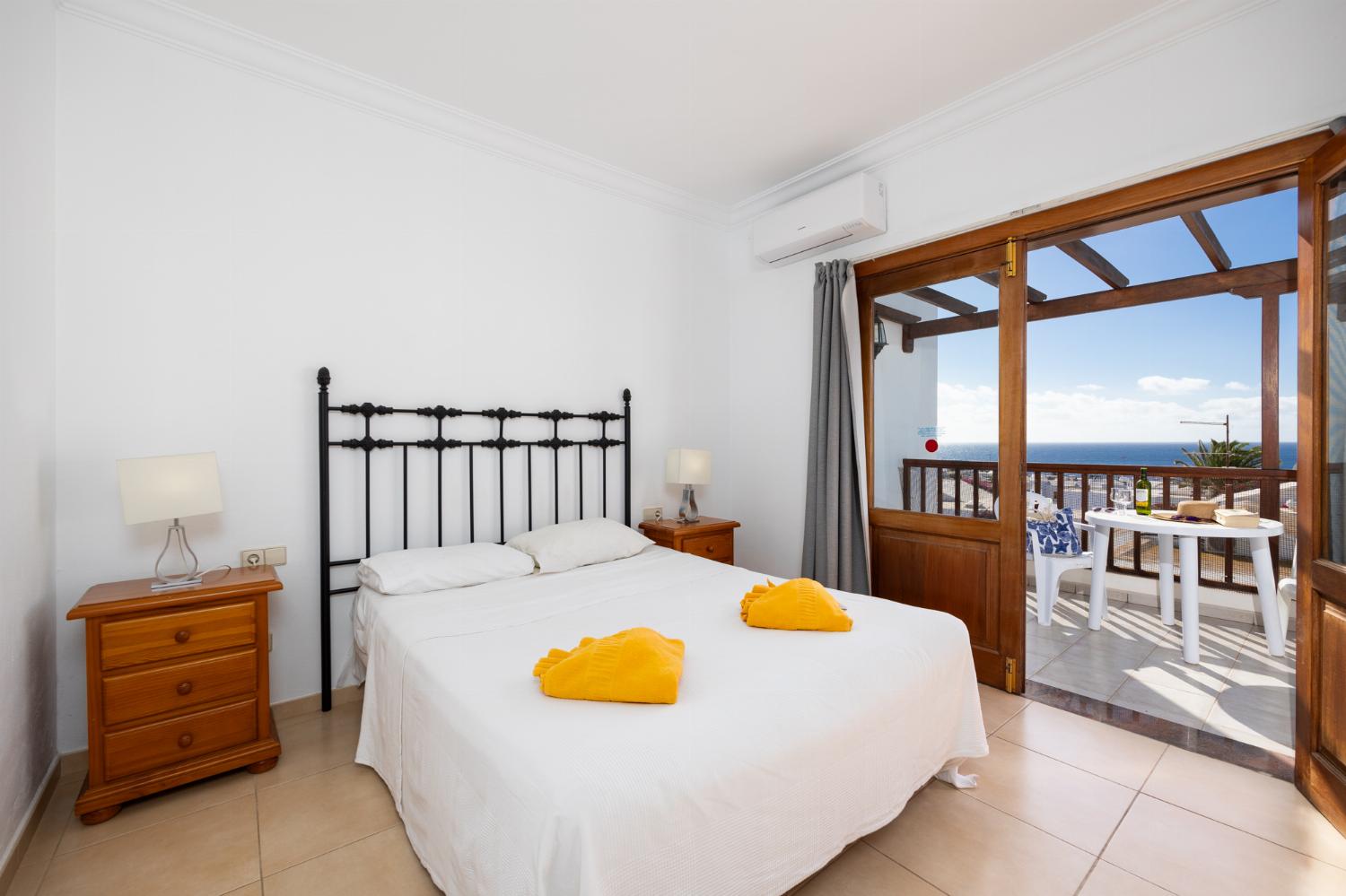 Double bedroom with en suite bathroom, A/C, and sea views