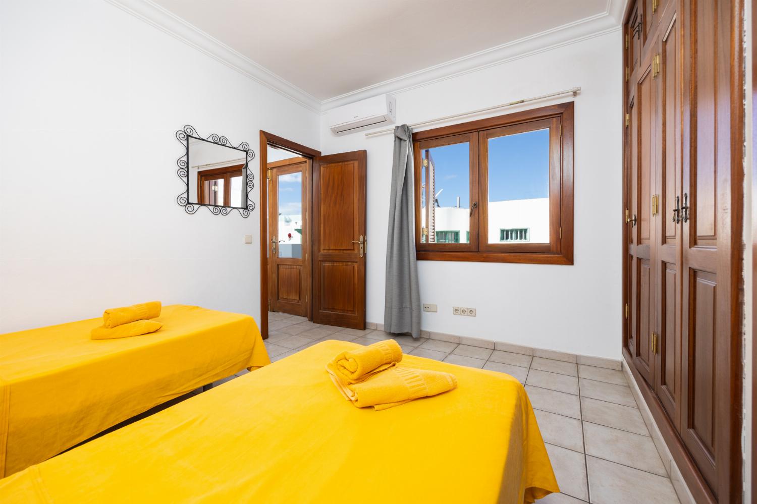 Twin bedroom with en suite bathroom and A/C