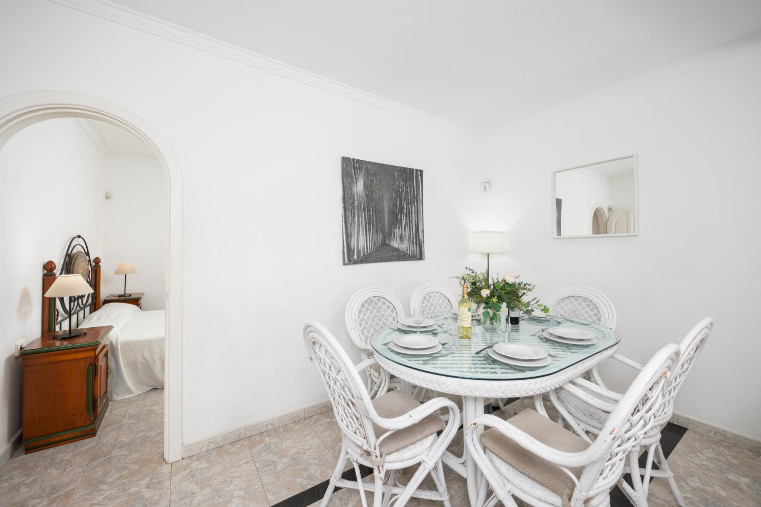 Open-plan living room with sofa, dining area, kitchen, WiFi internet, and satellite TV