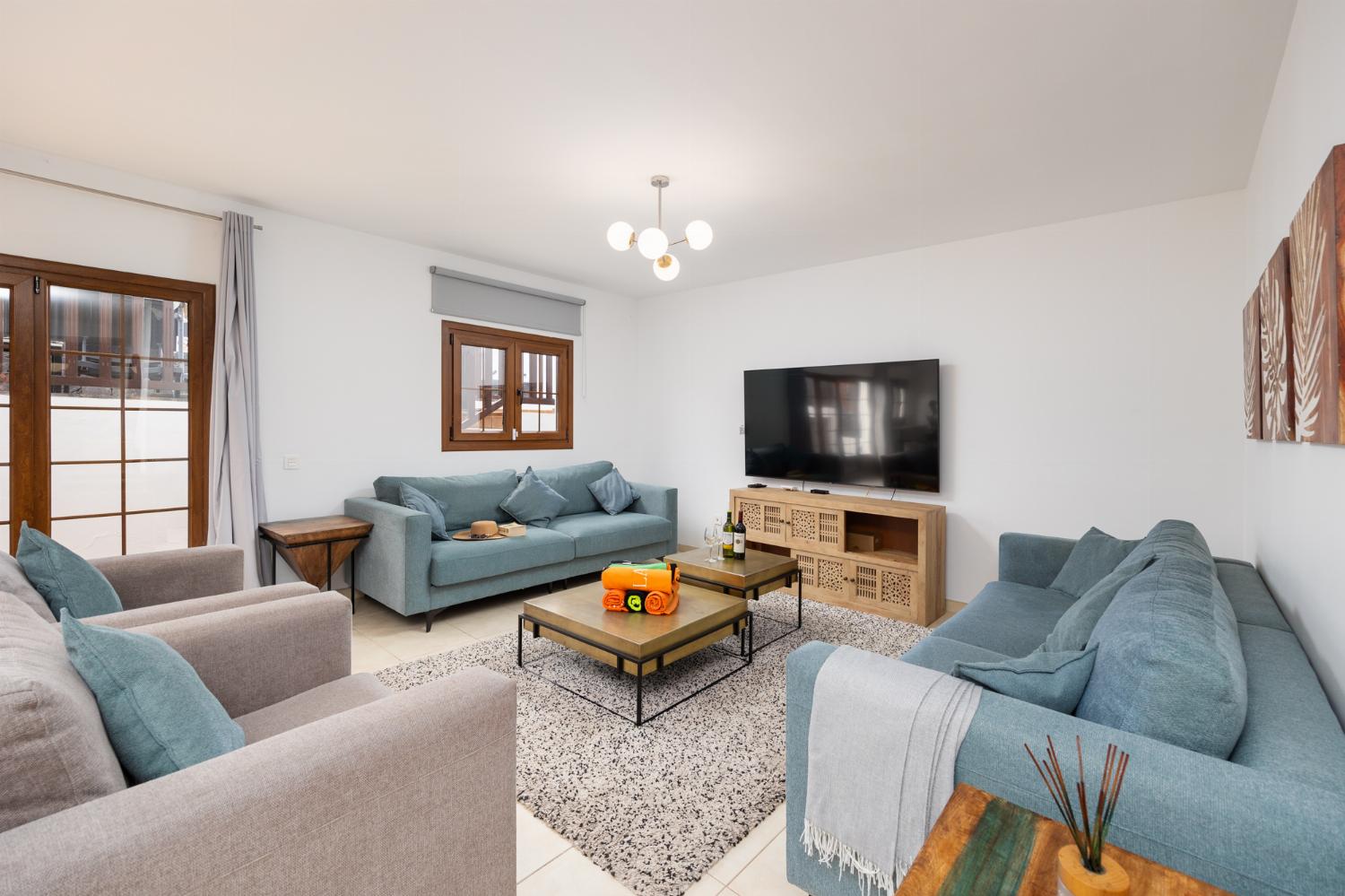 Living room with sofas, dining area, pool table, WiFi internet, and satellite TV