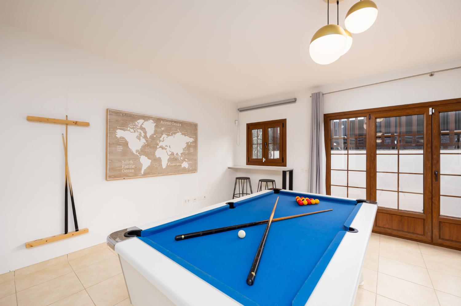 Living room with sofas, dining area, pool table, WiFi internet, and satellite TV