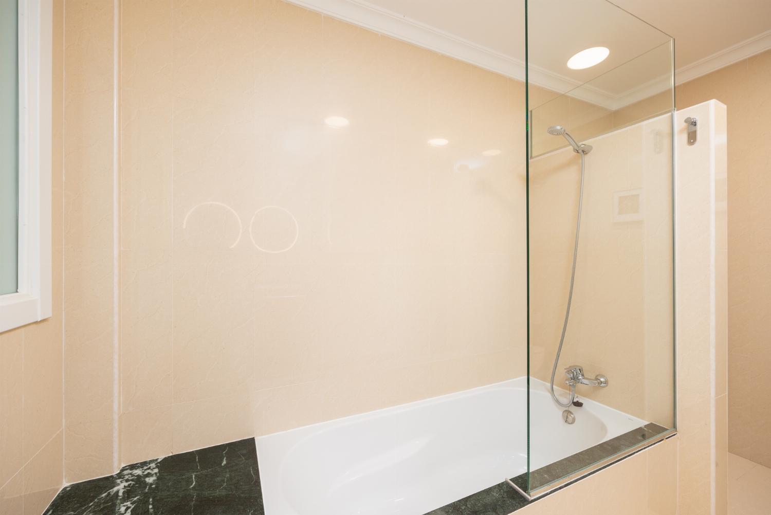 Family bathroom with bath and shower