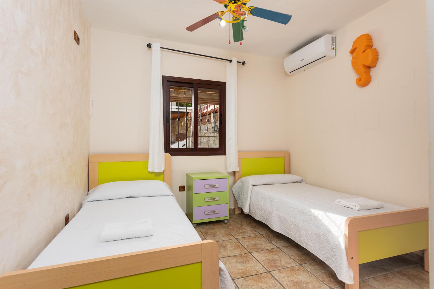 Twin bedroom with A/C