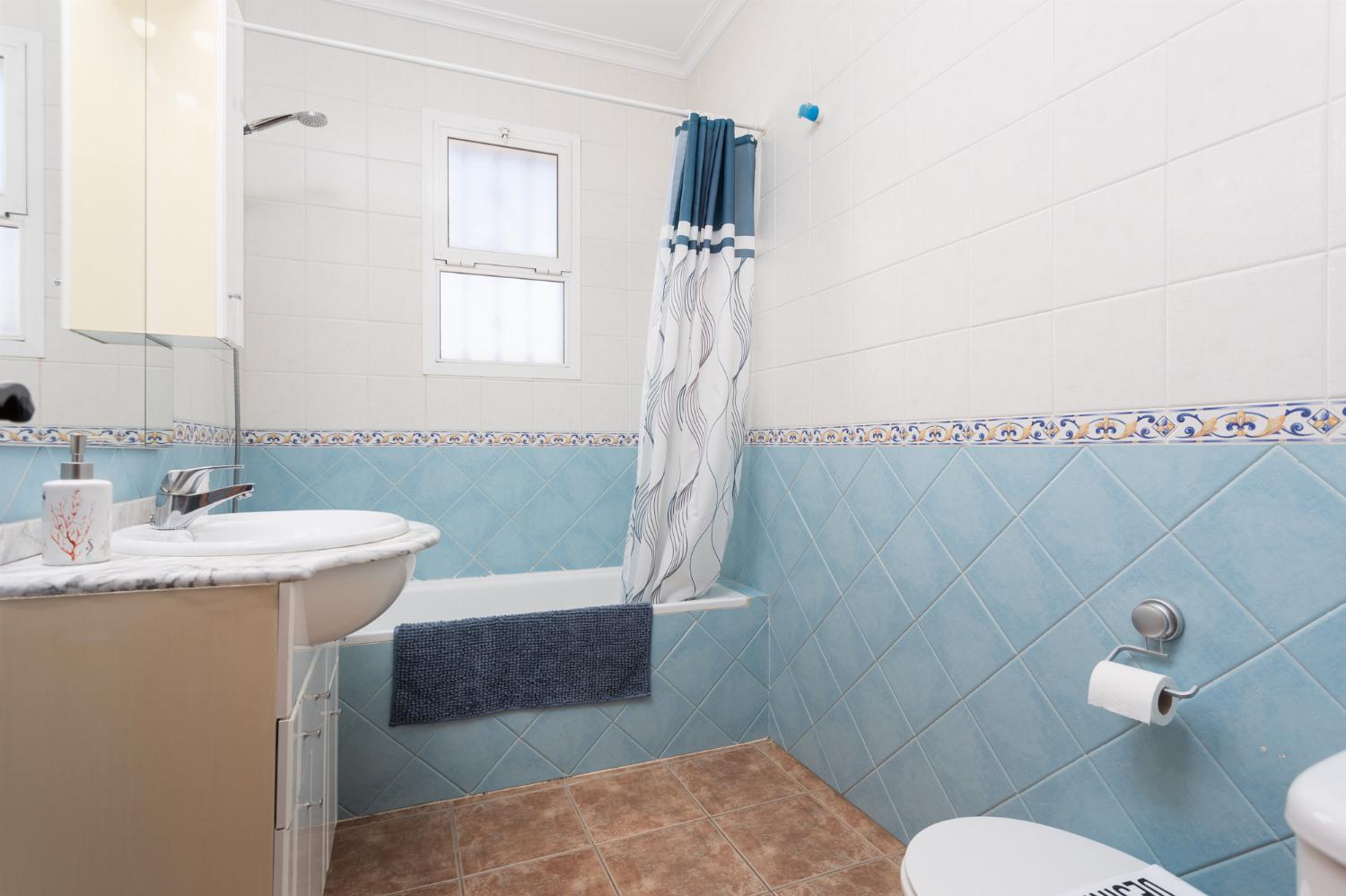 Family bathroom with bath and shower