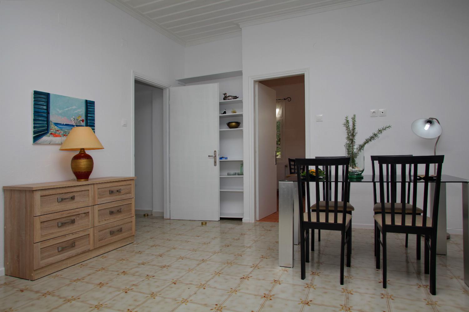 Open-plan living room with sofa, dining area, kitchen, WiFi internet, satellite TV