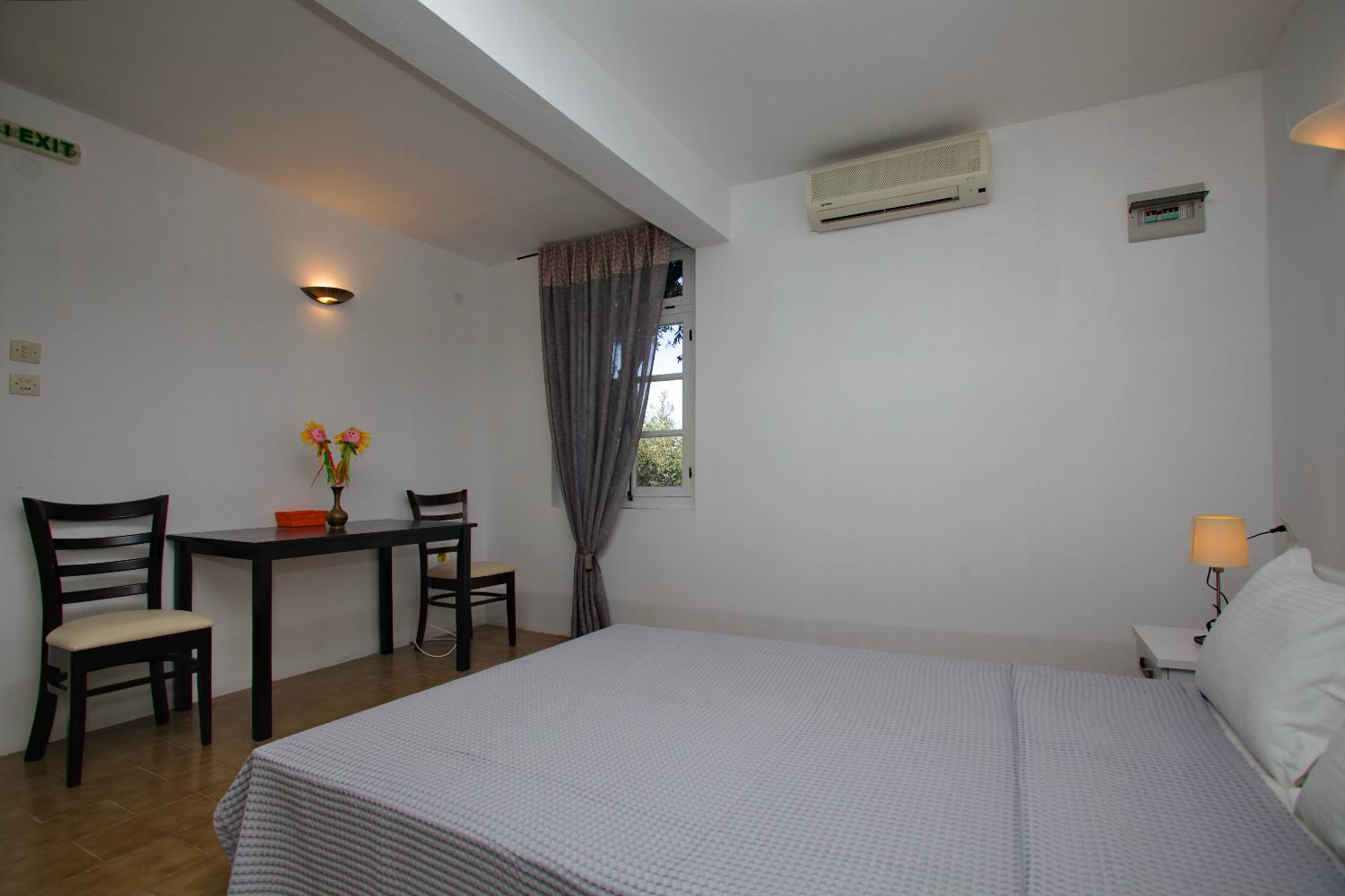 Double bedroom with A/C and en suite bathroom
