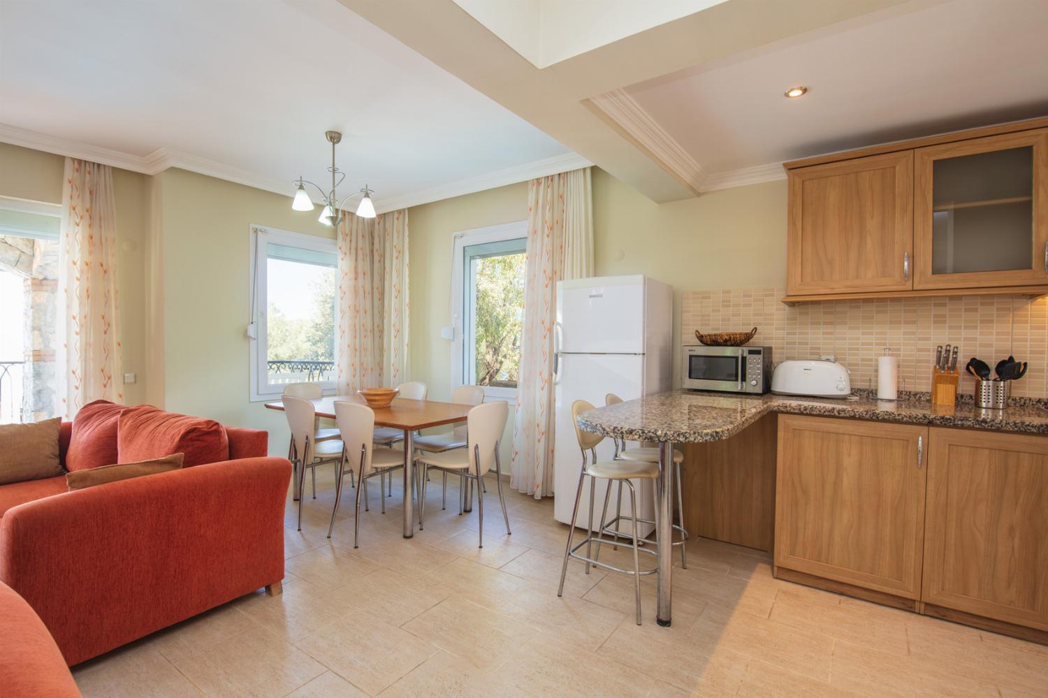 Dining area with equipped kitchen