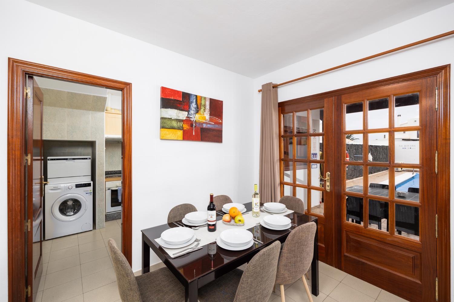 Living room with sofas, dining area, WiFi internet, and TV