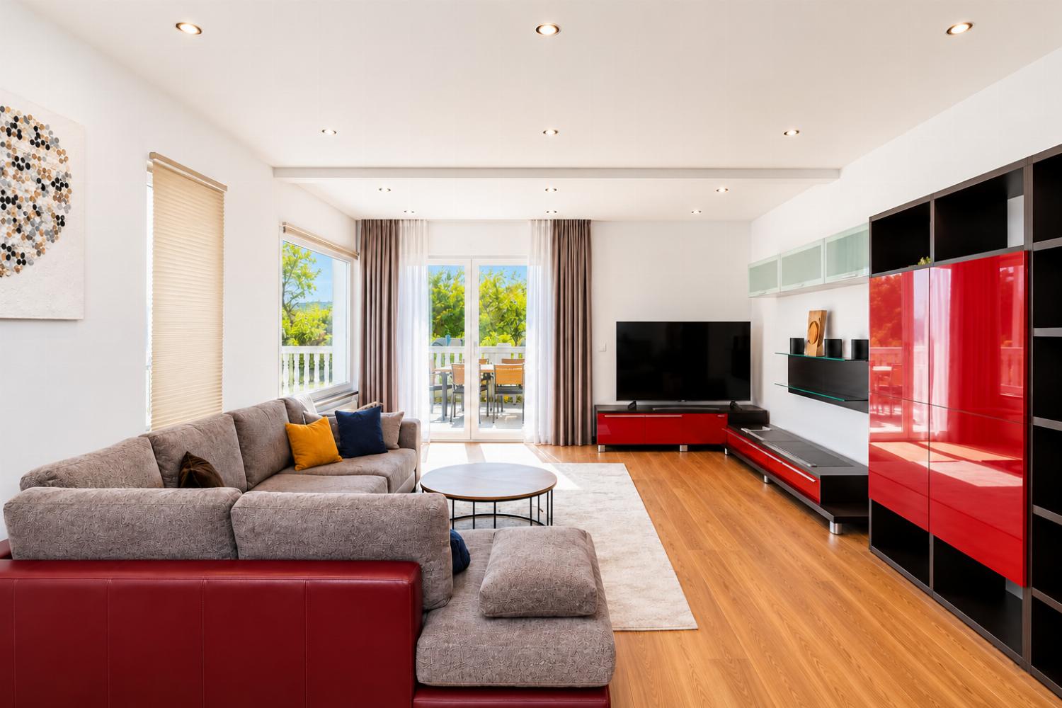 Open-plan living room with sofa, dining area, kitchen, WiFi internet, satellite TV