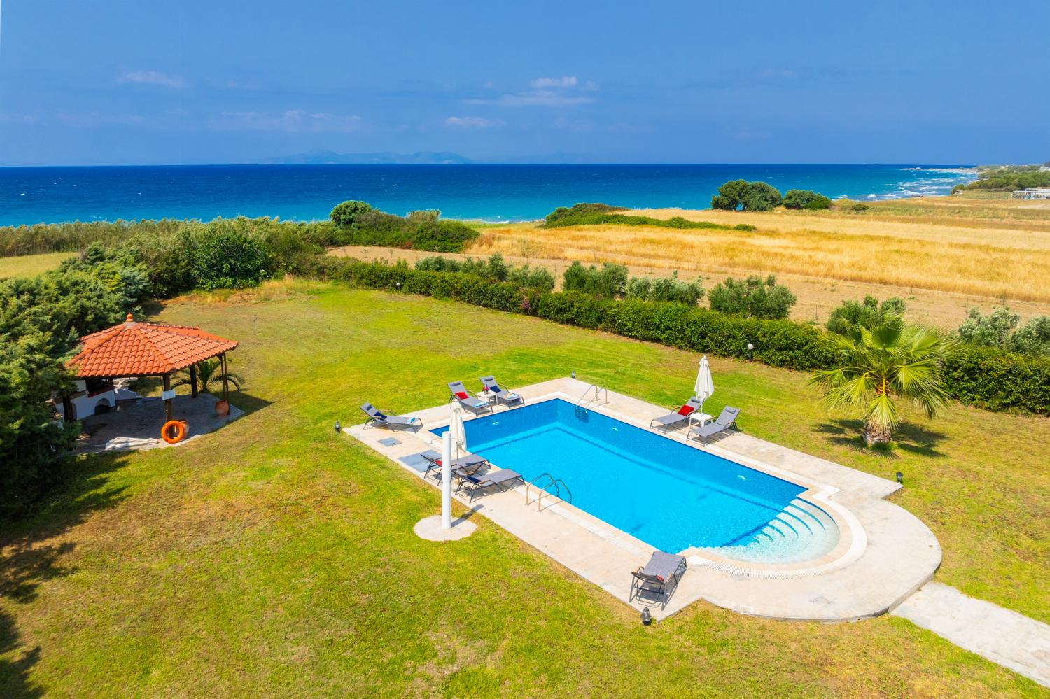 Private pool, terrace, and garden with sea views